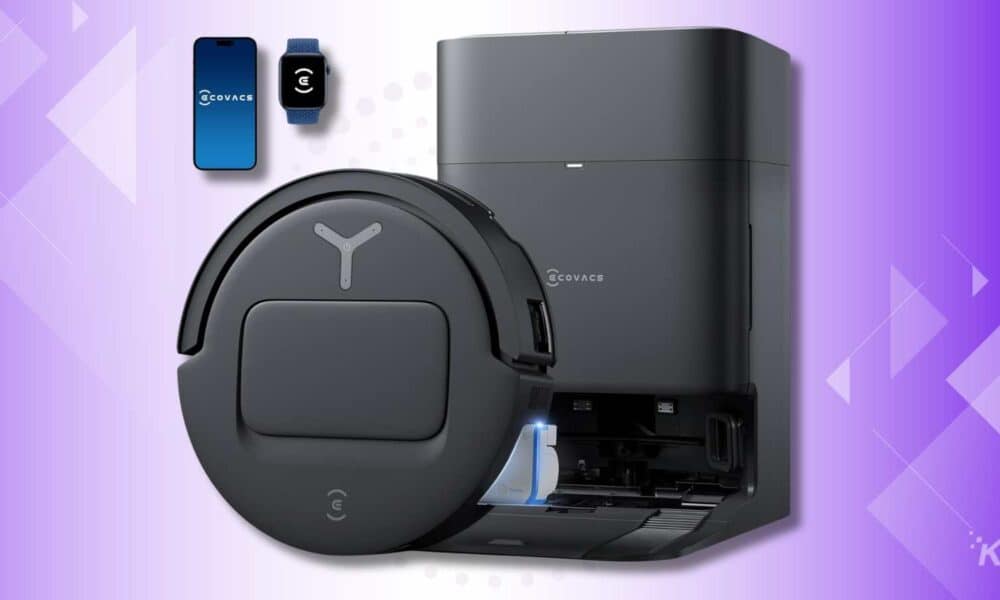 Smart robot vacuum and charging station on purple background
