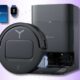 Smart robot vacuum and charging station on purple background
