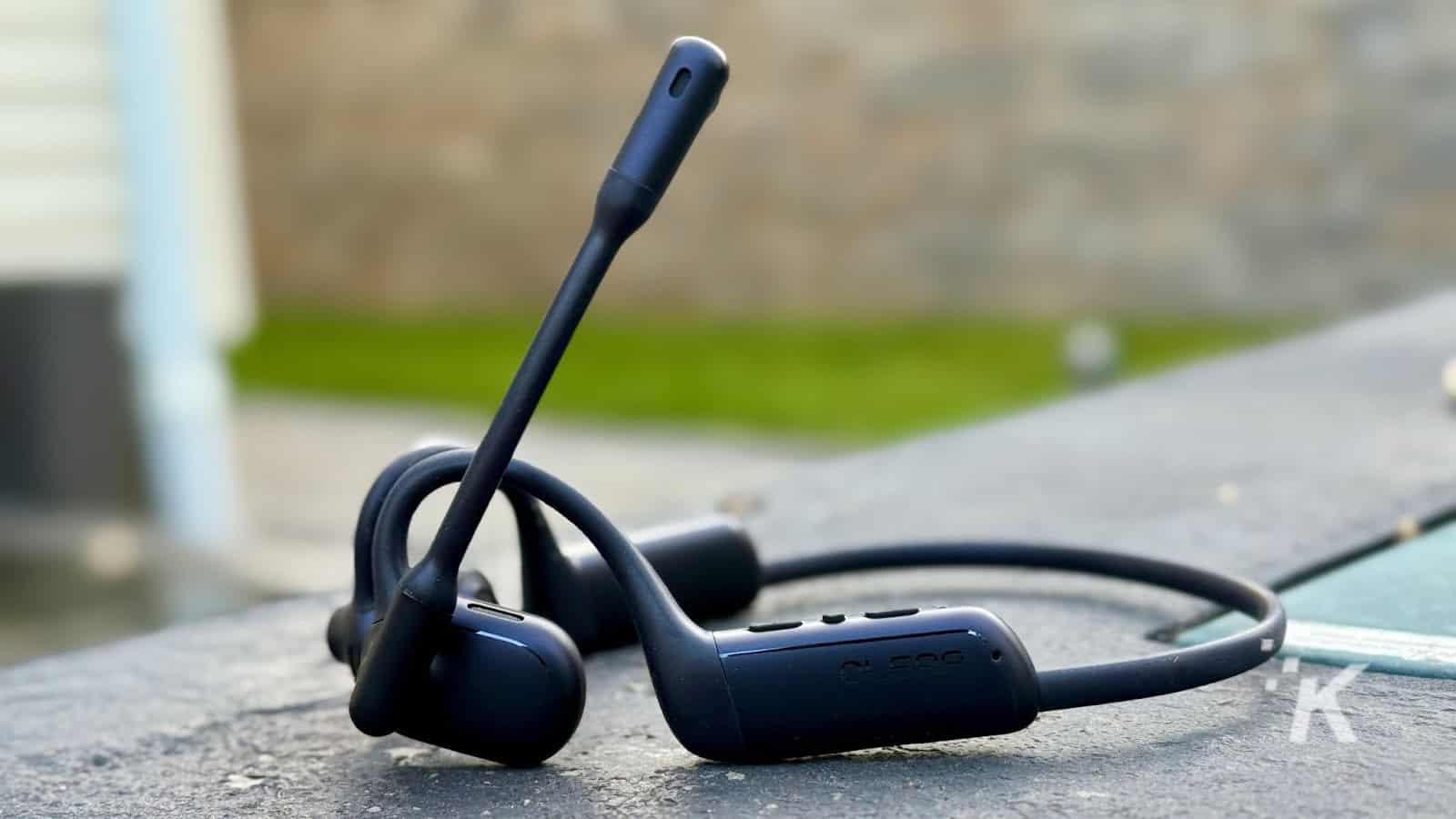 Black bone conduction headphones with mic on table