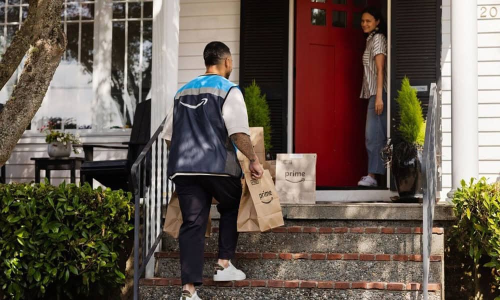 Delivery person brings packages to doorstep