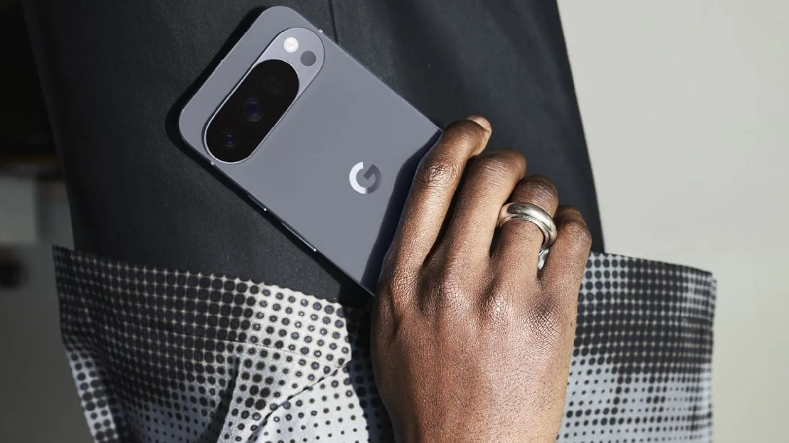 Person holding a smartphone in pocket.