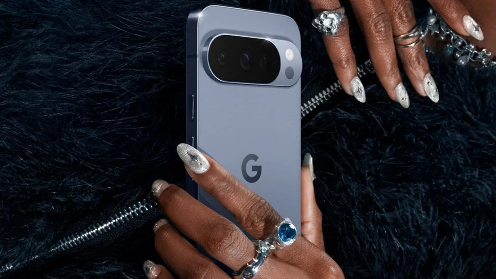 Person holding a Google smartphone with rings.