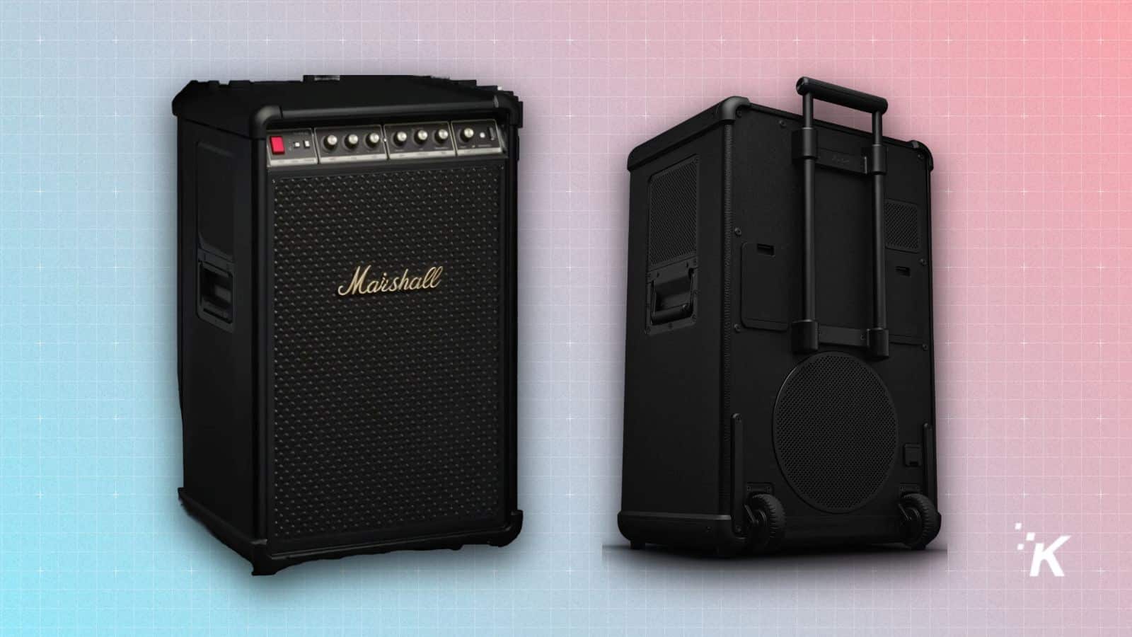 Black portable guitar amplifier with handle and wheels.