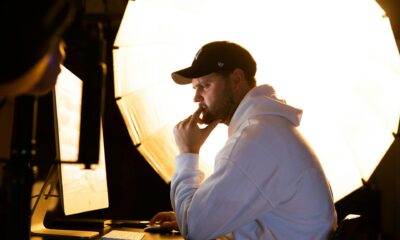 Man thinking while working at computer with backlight.