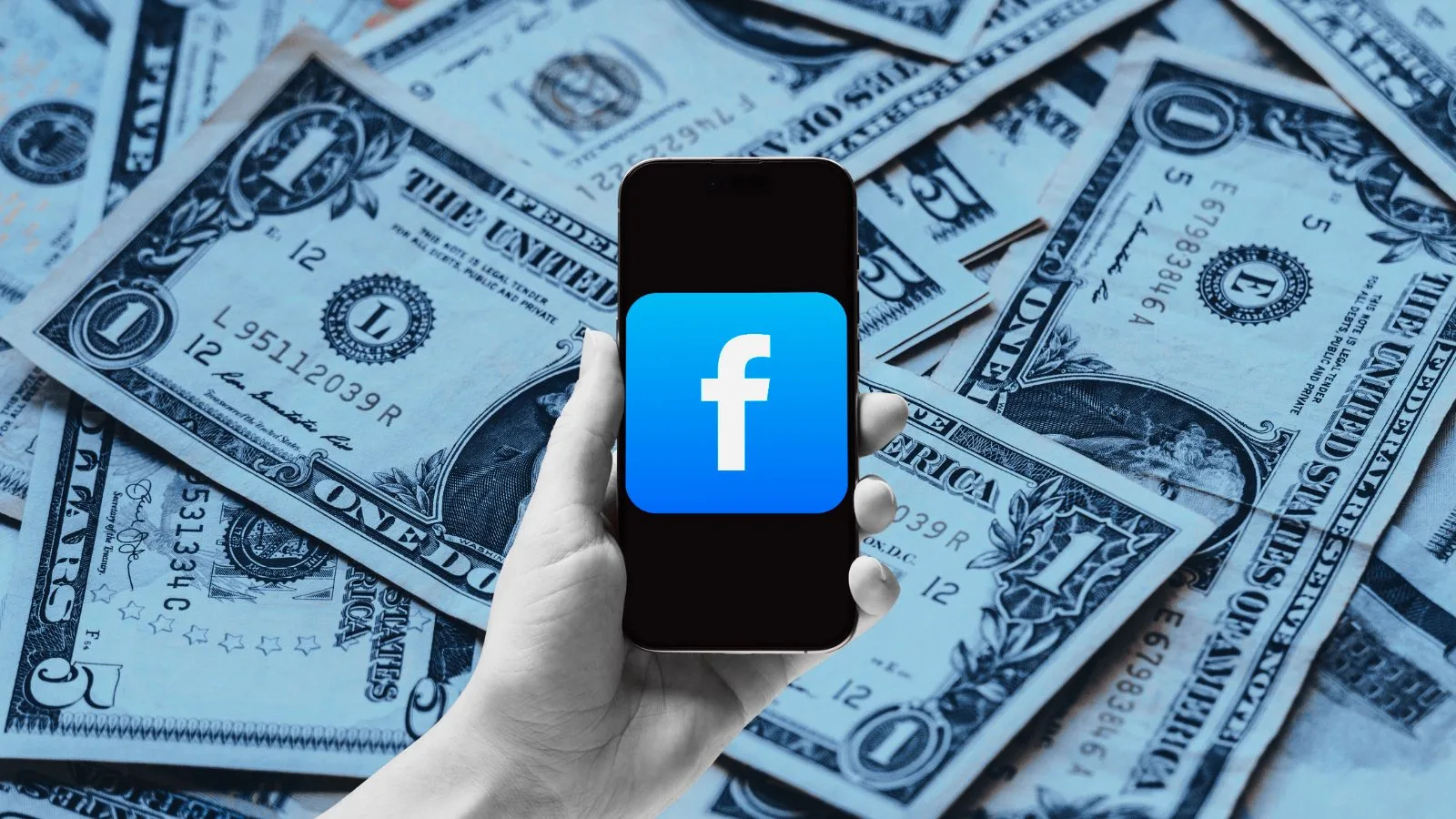 Smartphone with Facebook logo on dollar bills background