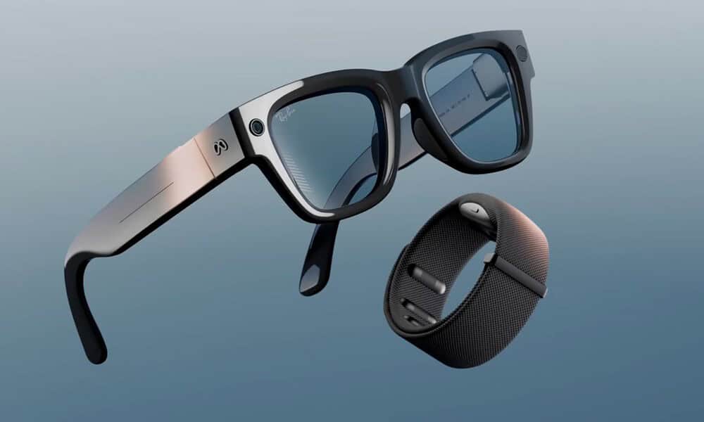 Smart glasses and wristband on blue background.