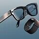 Smart glasses and wristband on blue background.