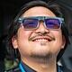 Men wearing augmented reality glasses, smiling, technology, AR glasses, wearable tech, innovation, future tech, smart glasses, virtual reality, tech accessories.