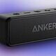 Wireless portable Bluetooth speaker with Anker branding, compact design, and control buttons on top, ideal for outdoor and indoor audio experiences.