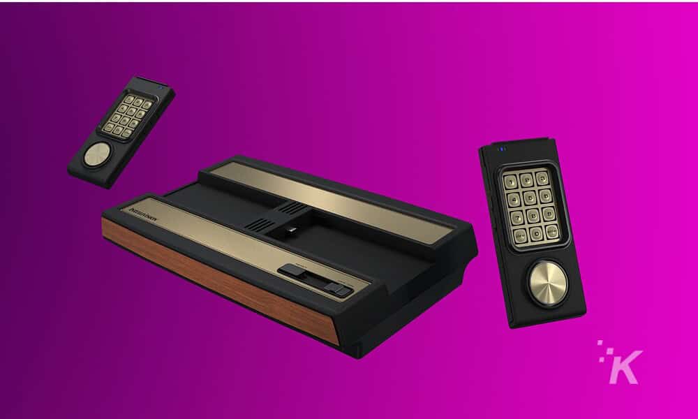 Vintage handheld calculator with remote control styled interface on a purple background.