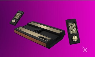 Vintage handheld calculator with remote control styled interface on a purple background.