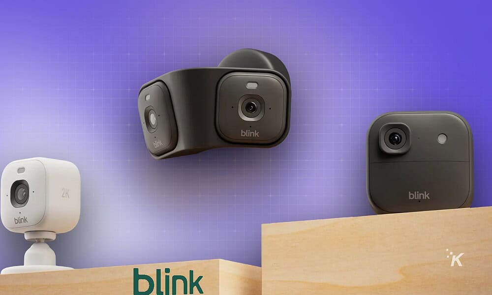 Miniature smart cameras mounted on a wooden shelf, showcasing innovative home security devices from Blink; various models are displayed against a purple gradient background.
