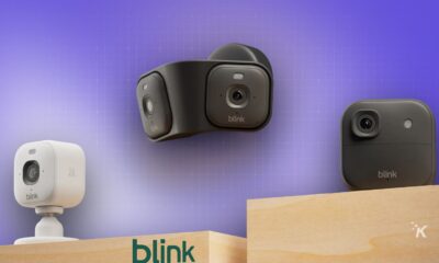 Miniature smart cameras mounted on a wooden shelf, showcasing innovative home security devices from Blink; various models are displayed against a purple gradient background.