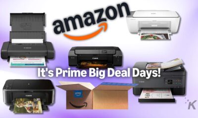 High-quality photo of various Canon printers and an Amazon Prime box promoting printer deals during Prime Big Deal Days.