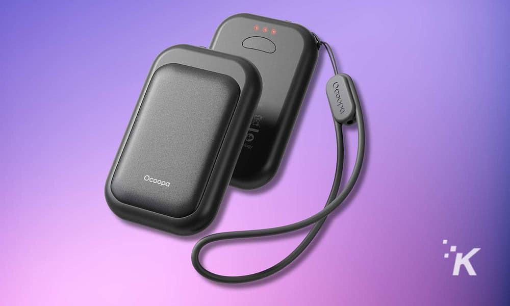 Portable wireless charger with a power bank and charging cable, designed for mobile devices.