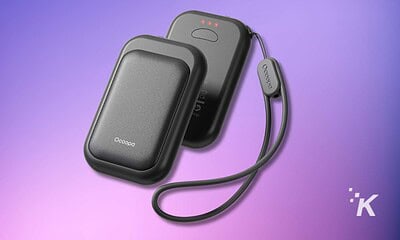 Portable wireless charger with a power bank and charging cable, designed for mobile devices.