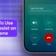 Hold assist feature on iPhone screen during a call, showing options to mute, end, or put the call on hold for hands-free communication.