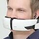 Wireless virtual reality headset for immersive gaming experiences, worn by a young man with blue eyes and short blond hair, connected with earphones for enhanced audio.