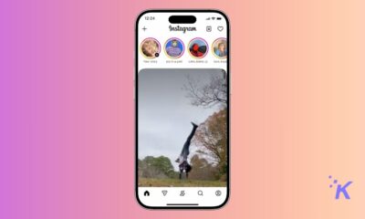 A person performing a handstand outdoors on an iPhone screen showing Instagram app interface with stories and icons.