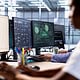 AI-driven cybersecurity expert analyzing digital security systems on multiple monitors in a modern office.