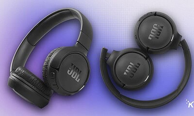 JBL over-ear wireless headphones with foldable design on a purple gradient background.