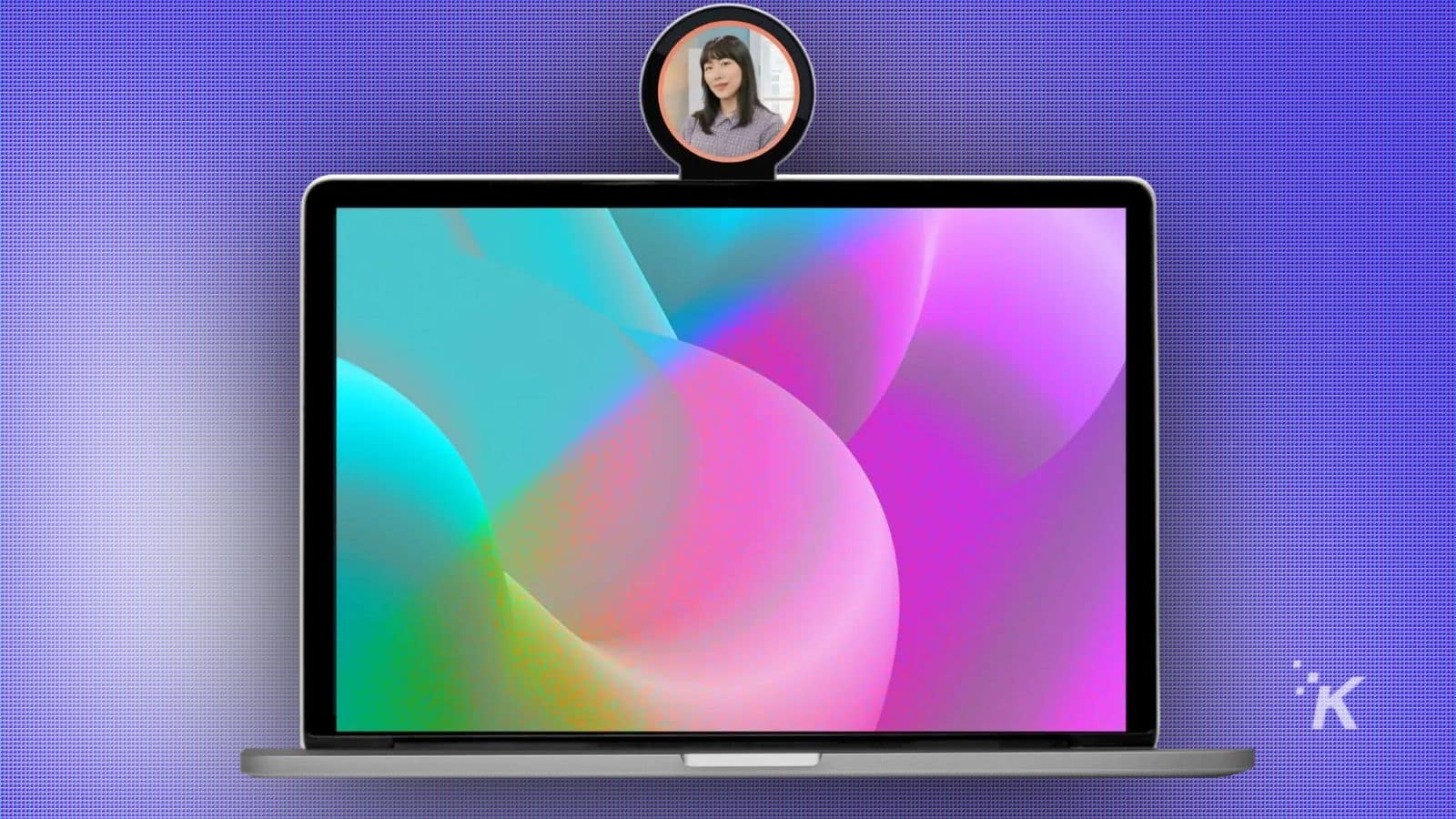 User profile camera on a MacBook displaying a woman's face, set against a purple textured background, illustrating modern technology and video conferencing features.