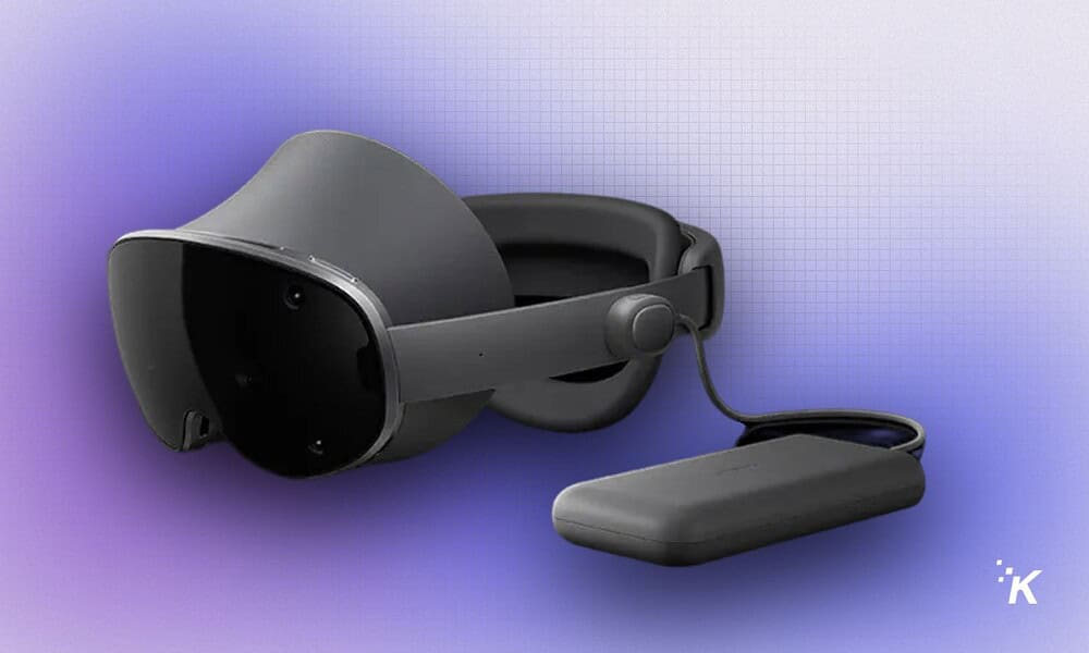 Virtual reality headset with attachment on a purple gradient background.