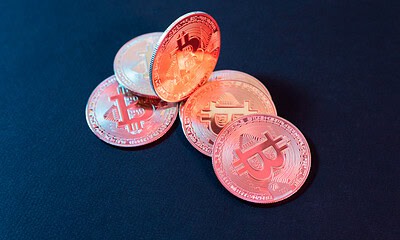 Cryptocurrency coins, Bitcoin digital currency, financial technology, blockchain, virtual money, digital trading.