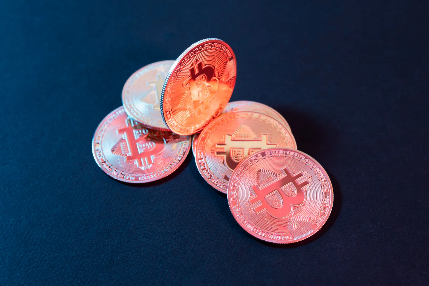 Cryptocurrency coins, Bitcoin digital currency, financial technology, blockchain, virtual money, digital trading.