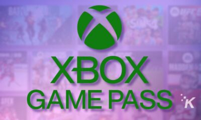 Xbox Game Pass logo with a blurred background of game thumbnails, highlighting the popular gaming subscription service, ideal for gamers and tech enthusiasts.