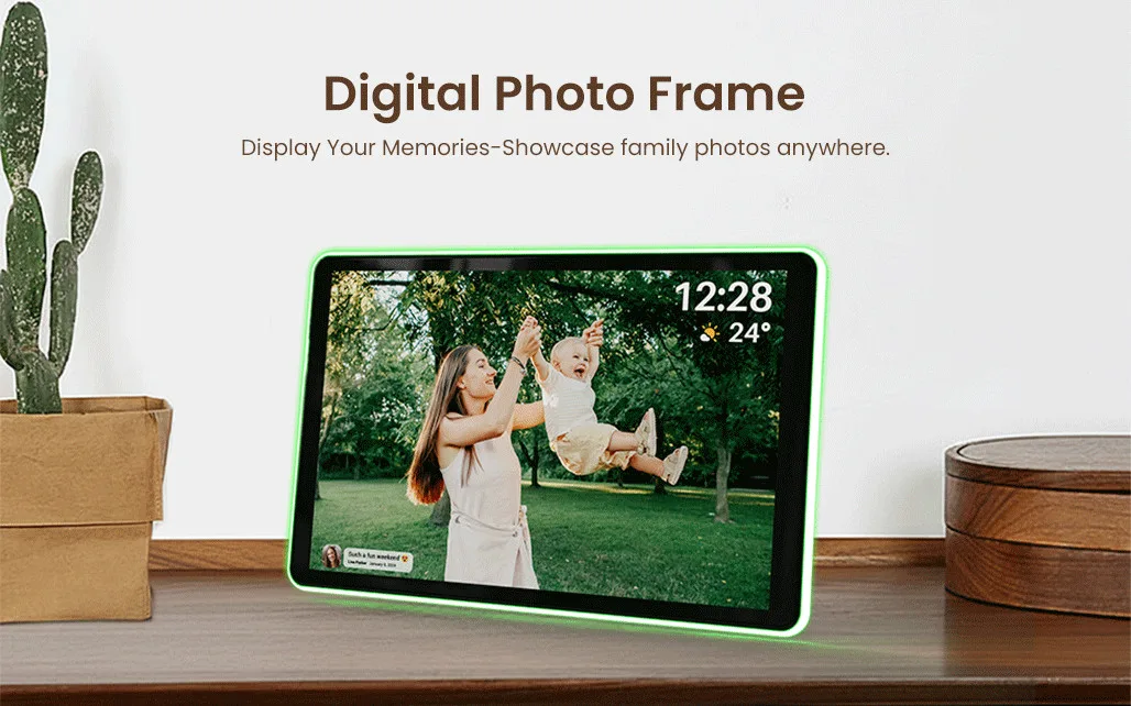 Digital photo frame displaying a family photo with a woman and child outdoors, neon green light border, on a wooden surface next to a potted cactus and a wooden container, perfect for showcasing family memories.