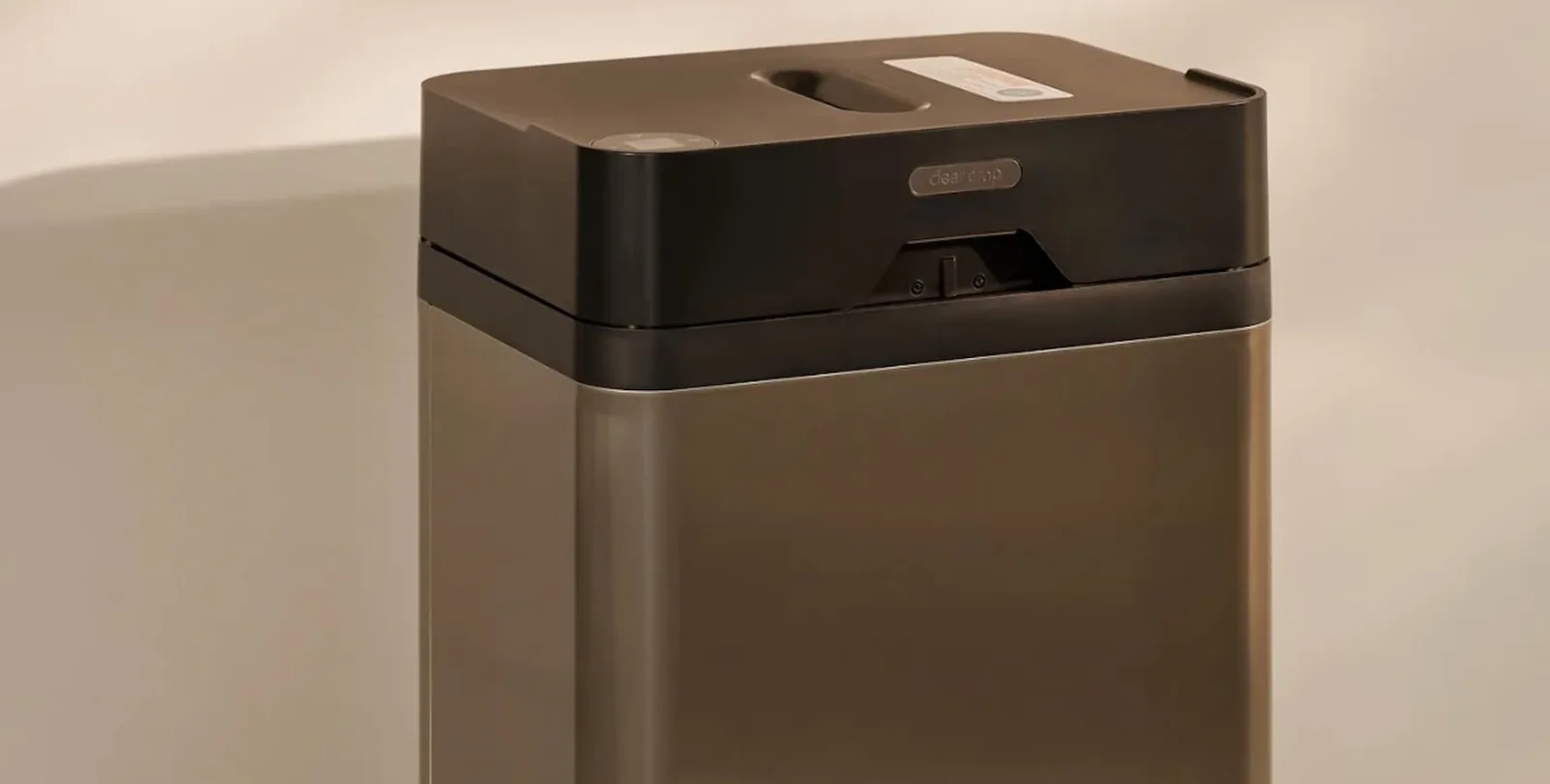 Modern paper shredder with black and bronze finish, ideal for secure document disposal in home or office settings.