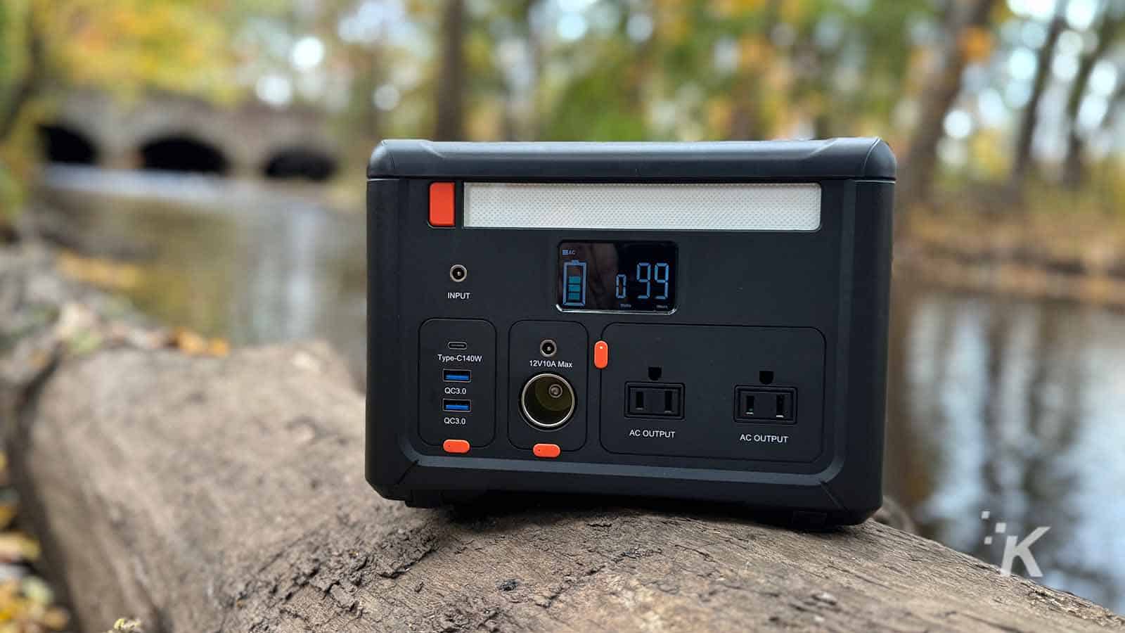 Compact portable power station with multiple outlets, USB ports, and digital display, ideal for outdoor activities and emergency backup power solutions.