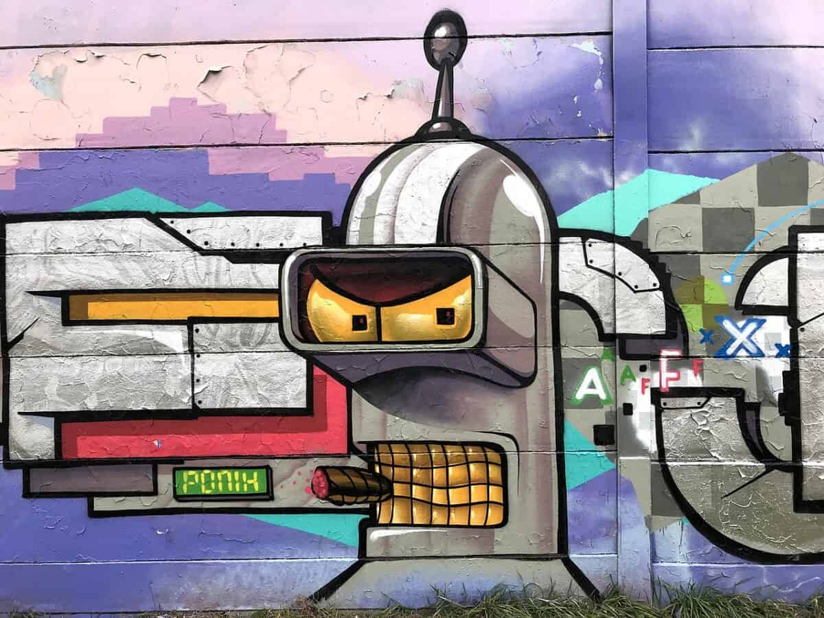 Colorful robot graffiti on urban wall