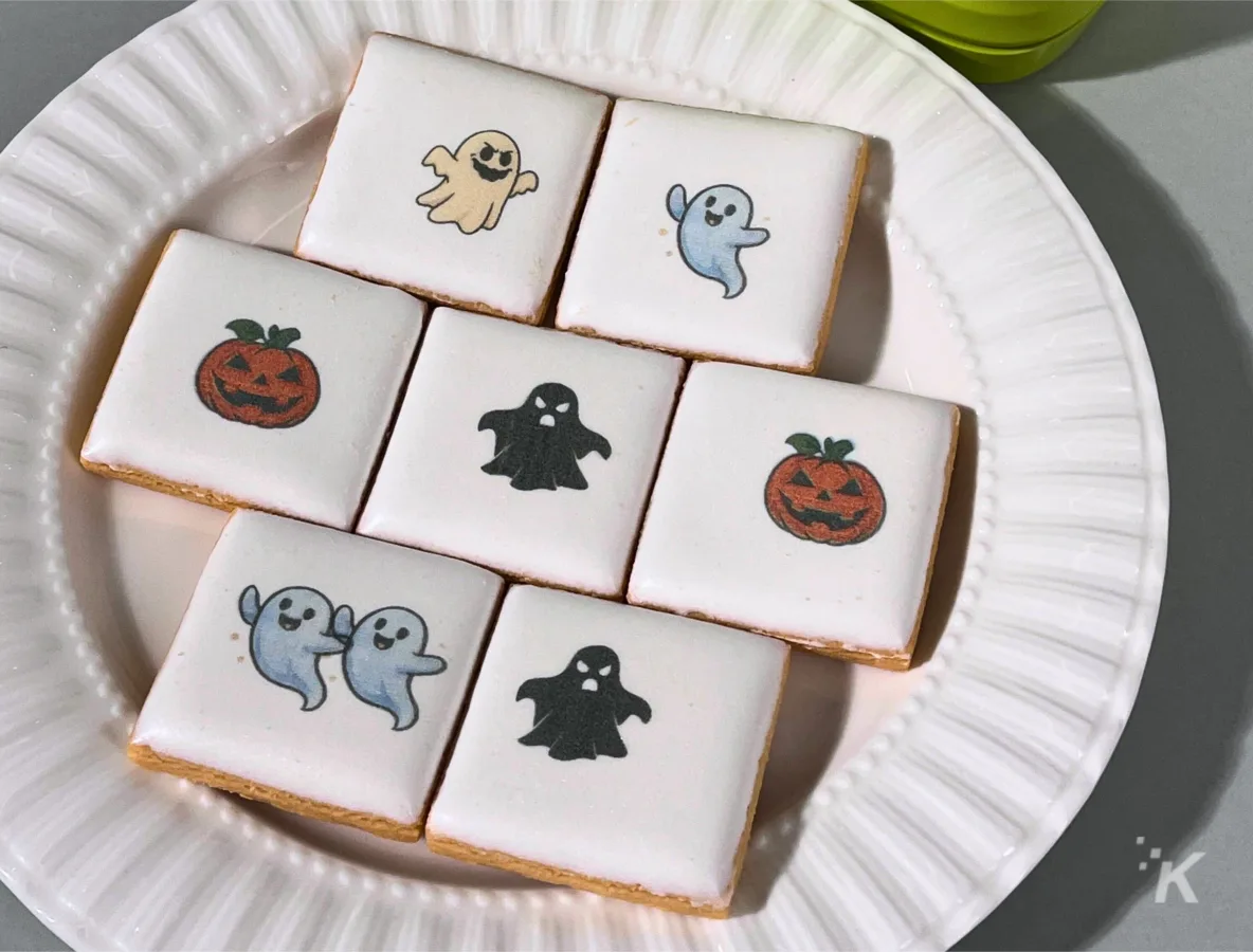 Halloween cookies with ghost and pumpkin designs.