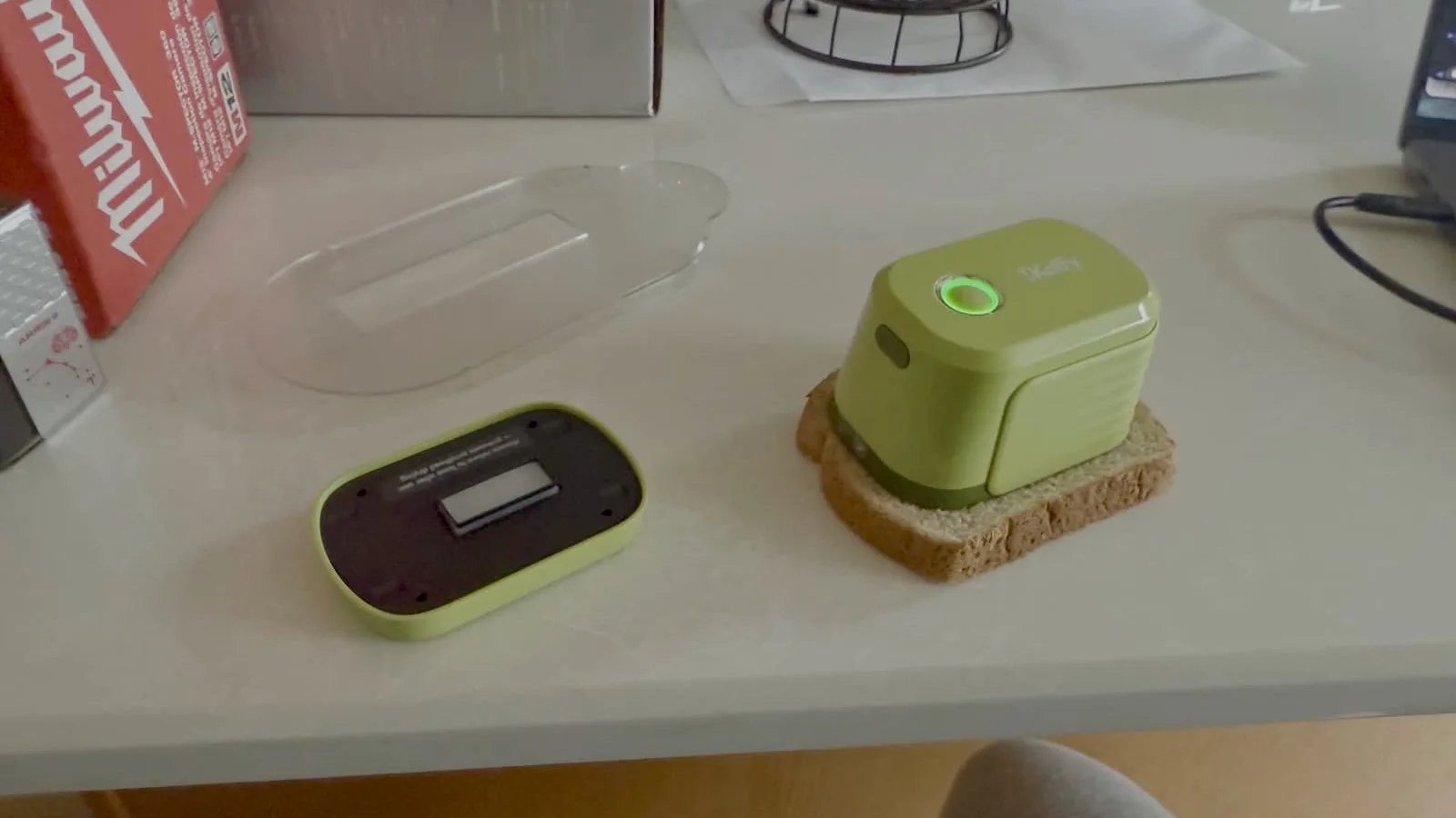 Kitchen gadget disassembled on a countertop.