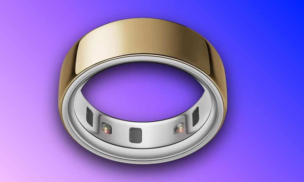 High-tech smart ring featuring customizable LED indicators, sleek gold and silver design, and wearable technology for health, fitness, and notifications.