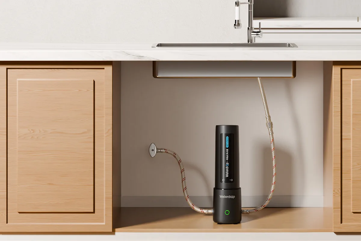Filtered water purifier device under a kitchen sink for clean drinking water.