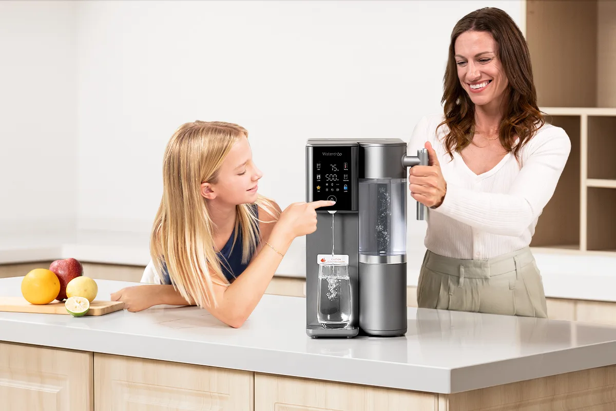 Child and adult using Waterdrop water purifier in a modern kitchen, promoting healthy hydration with clean, filtered water. Family enjoying fresh water from sleek, easy-to-use water filtration system in bright, contemporary home.