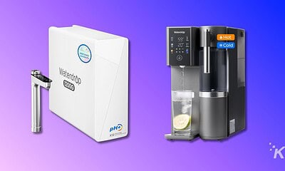 Filtered water dispenser with pH upgrade system and water filtration, featuring hot and cold water options for home or office use.