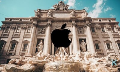 Bold black Apple logo overlay on historic building, showcasing Apple's iconic branding and modern technology presence in Rome with classical architecture and clear blue sky.