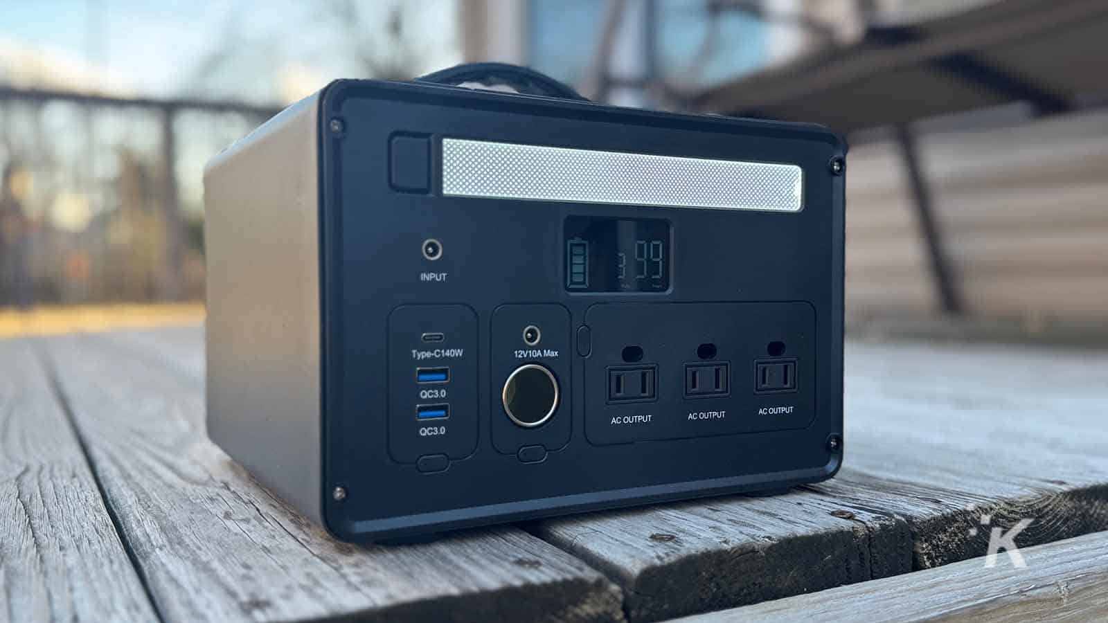 Portable power station on wooden deck.