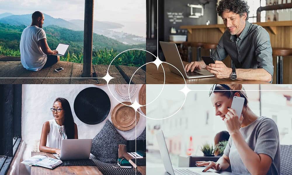 Young person using a laptop outdoors with scenic mountain view.
