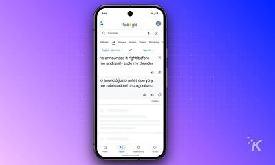 An image showing a smartphone displaying Google Translate with a translation from English to Spanish. The app interface highlights language detection and text translation functions for seamless language conversion.