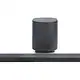Elegant black sound system with tall subwoofer and long soundbar, ideal for home theater setups and enhancing TV sound quality.