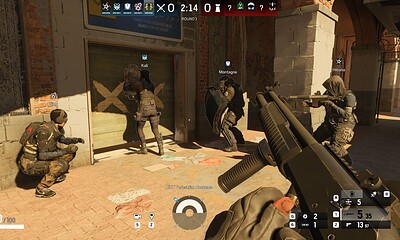High-action scene from tactical first-person shooter video game featuring team members positioned outside a building.