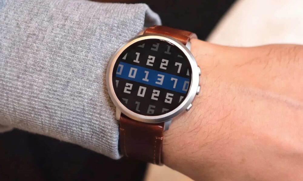 Alt text: Modern smartwatch on a wrist showing binary digits with a sleek design and leather band.