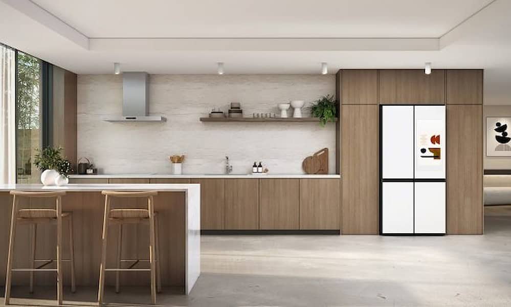 Bright and stylish kitchen featuring sleek wood cabinetry, a built-in smart refrigerator, and modern decor for contemporary home technology.