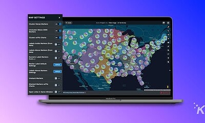 Interactive map showing data analytics and clustering markers across the United States on a laptop screen.
